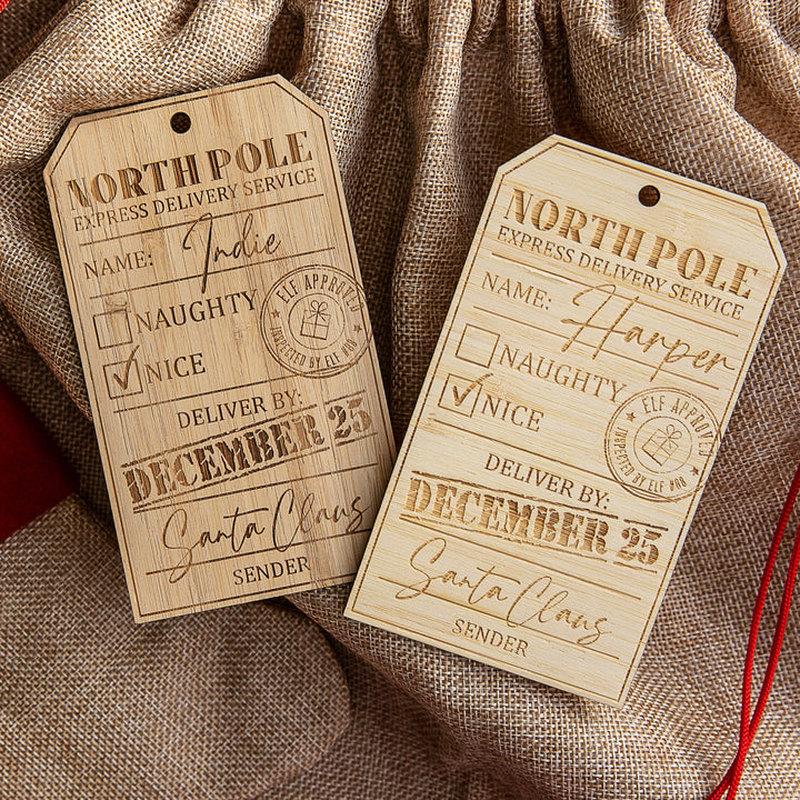 Two Personalised North Pole Gift Tags, labeled "North Pole Express Delivery Service" with the Nice box checked and names Indie and Harper, make perfect Santa Sack tags for Christmas.