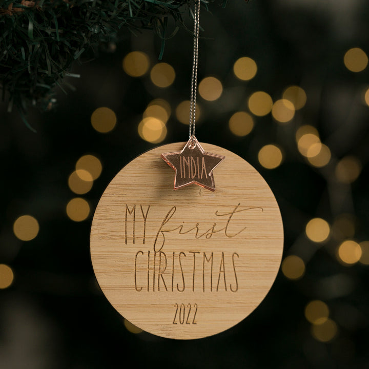 A round bamboo ornament with the text &