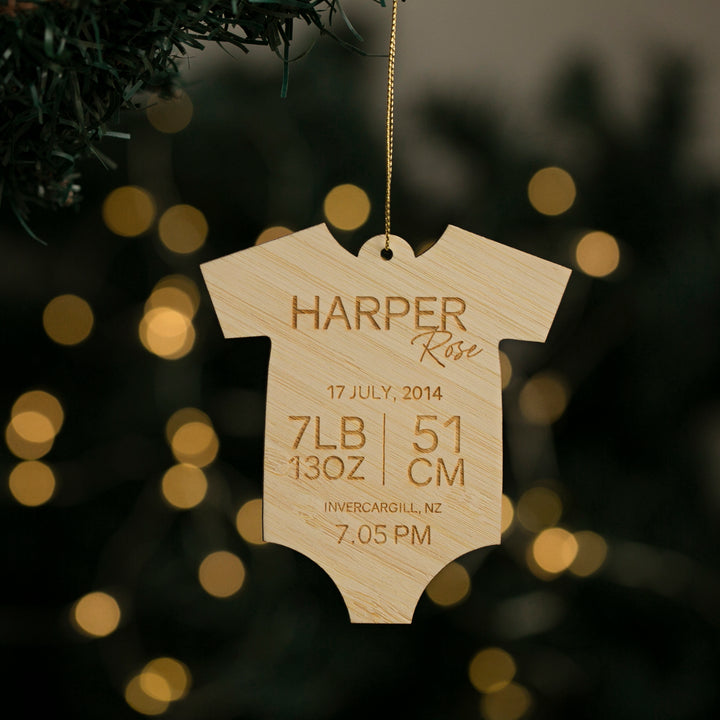 The Baby Bodysuit Christmas Bauble is a personalised wooden ornament featuring Harper Rose&