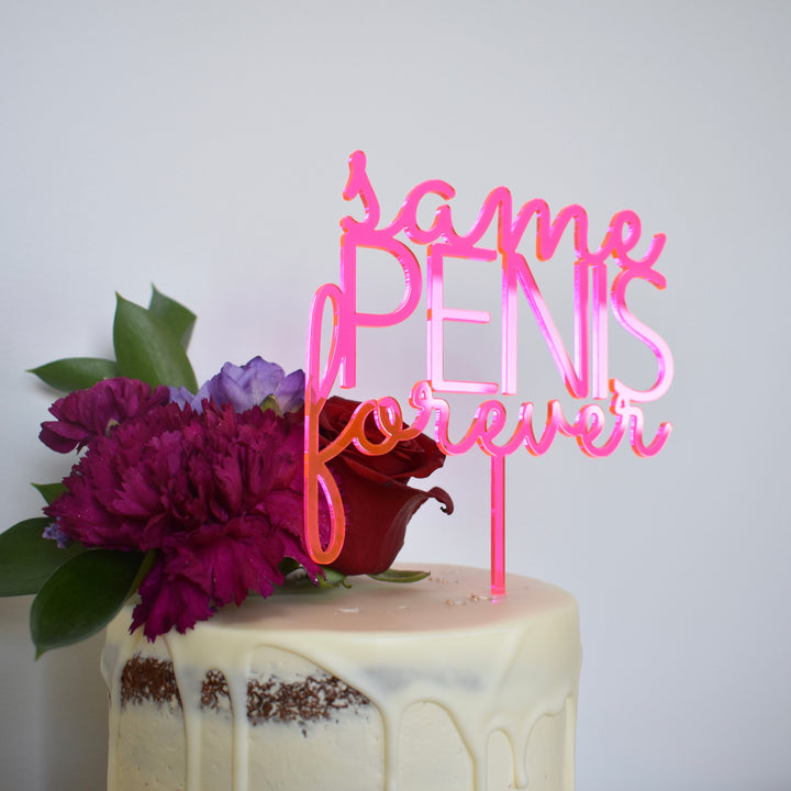 A white cake with floral decor is topped with a pink "Same P Forever" acrylic cake topper (other colours available) in cursive. The background is plain white.