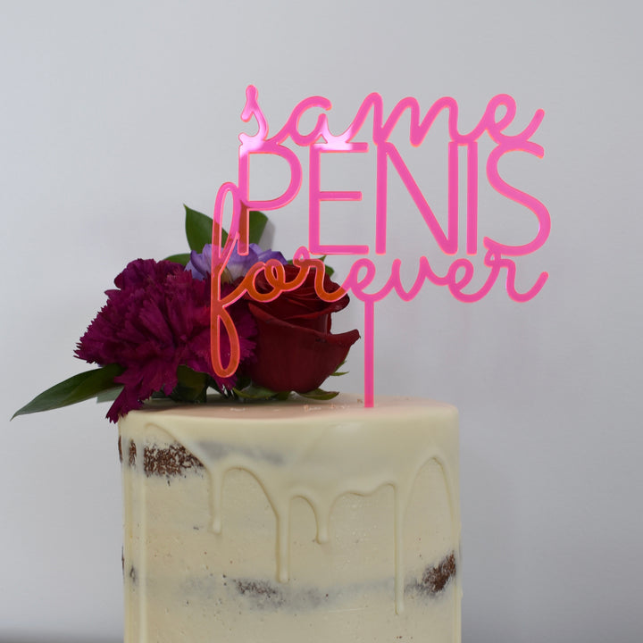 The Same P Forever Cake Topper (available in other colours) is a cheeky pink acrylic decoration for a white drip cake with a red rose and purple flowers—perfect for any bachelorette or hen’s night party.