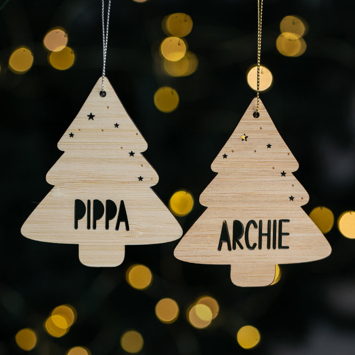 Two wooden Christmas tree ornaments with names &