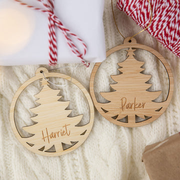 Two wooden Christmas tree ornaments with names &