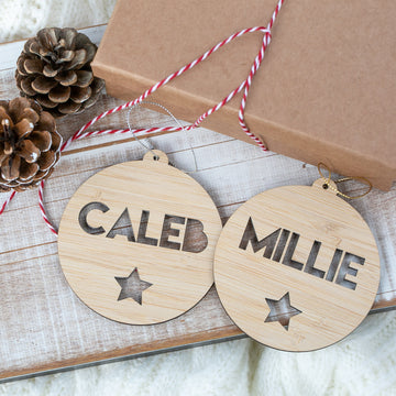 Two wooden ornaments with engraved names &