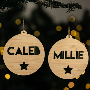 Two wooden ornaments with engraved names &