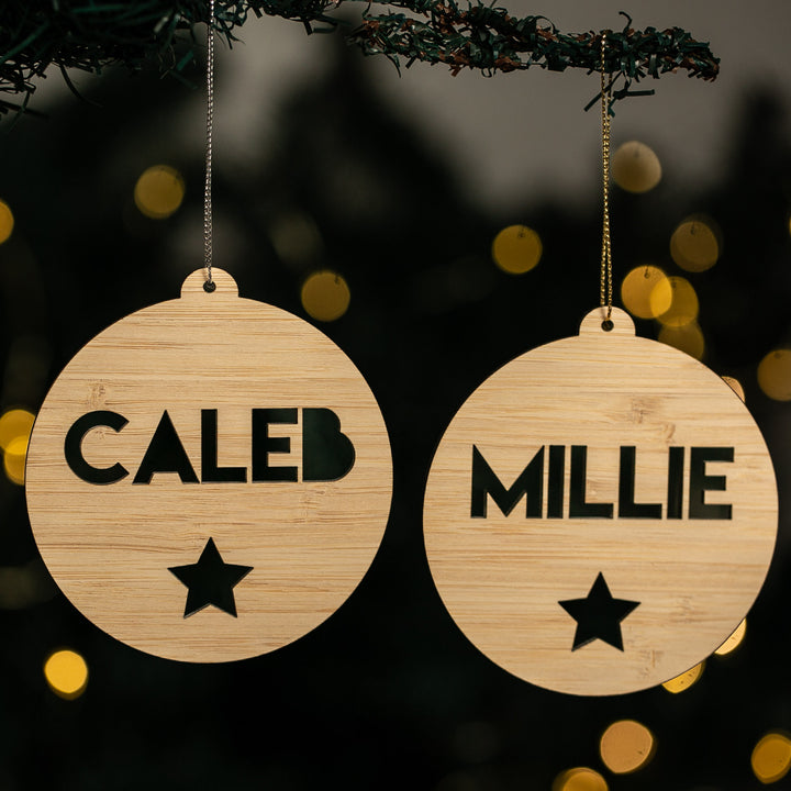 Two wooden ornaments with engraved names &