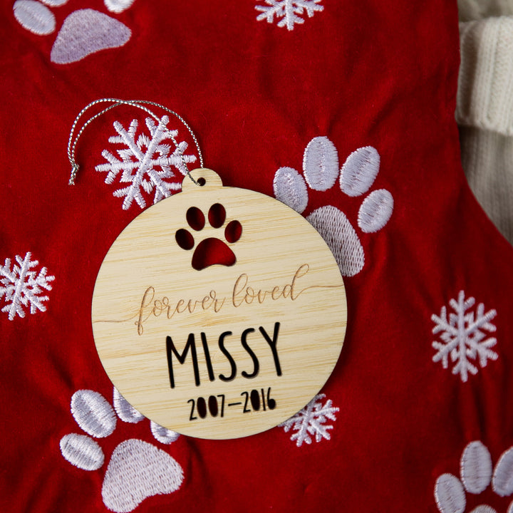 Wooden ornament with paw print and text &