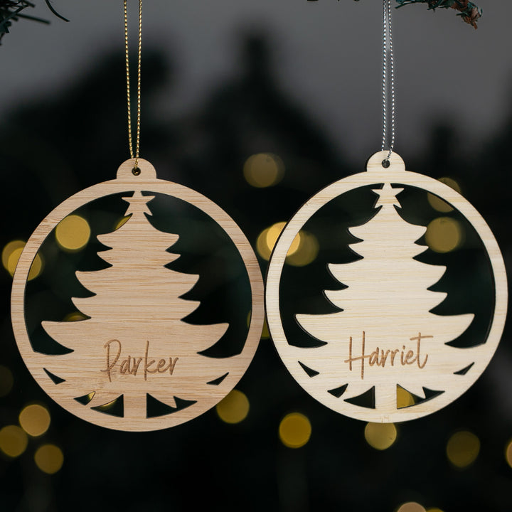 Two wooden Christmas tree ornaments with names &