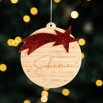 The Shining Star Teacher Christmas Bauble is a personalised wooden ornament with a red glitter star, engraved with “Thanks for helping me shine, Mrs Donnelly. From Harper 2024,” perfect as a festive teacher gift.