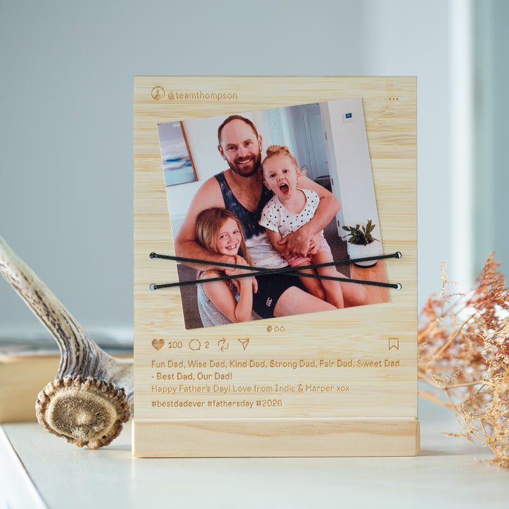 A personalized wooden photo plaque with a light natural wood finish, featuring a printed family photo, social media-style icons, and engraved Father&