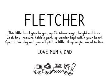 A card with the name Fletcher at the top, a Christmas poem about a magical Personalised Christmas Keepsakes Memory Box from Mum & Dad in the center, and a small illustration of a toy train with presents at the bottom.