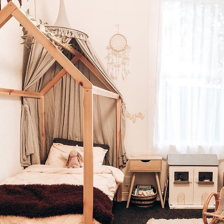 A bamboo name saying Ava, hanging on the wall in a children&