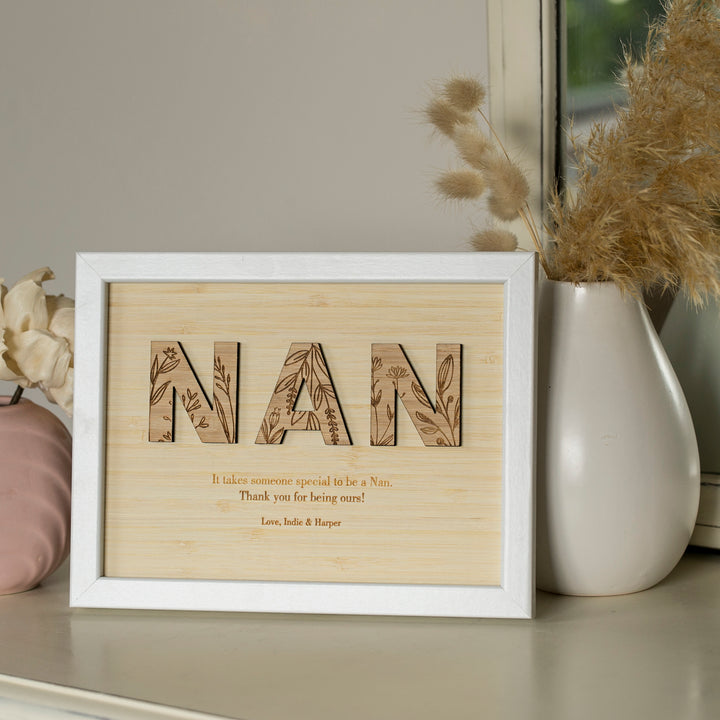 A Wildflower Frame Insert (frame not included) spells out NAN in floral letters, perfect for displaying with dried flowers. Below: "It takes someone special to be a Nan... Thank you for being ours!" A unique gift from Indie & Harper.