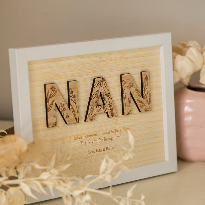 The Wildflower Frame Insert (frame not included) displays NAN in decorative, floral letters with the message: "It takes someone special to be a Nan. Thank you for being ours! Love, Indie & Harper." Dried flowers add charm to this unique gift.