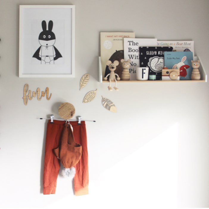 A bamboo wall name saying Finn, hanging on the wall in a child&