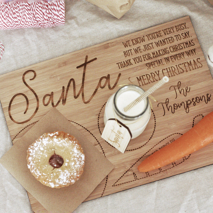 A Personalised Santa Treat Board, custom etched with your family&