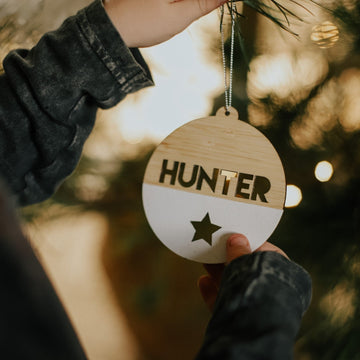 A personalized Christmas bauble with the name &