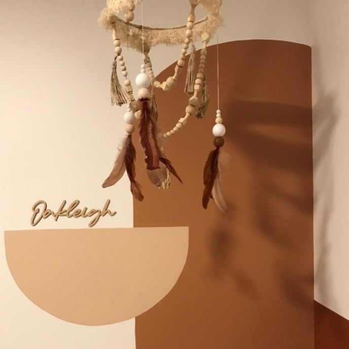 A bamboo wall name saying Oakleigh, hanging in a child&