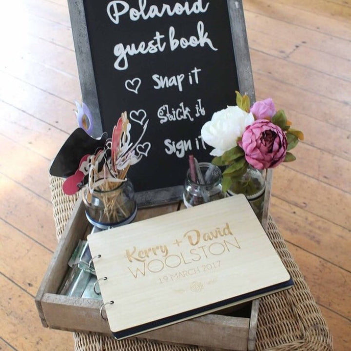 Light bamboo sample wedding guestbook, bound with jump rings and engraved custom design on the cover